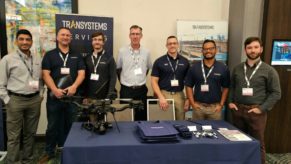 men standing at booth at event