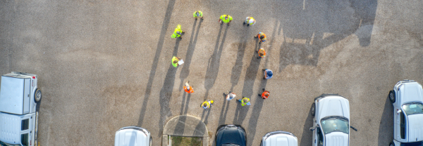 workers standing in circle